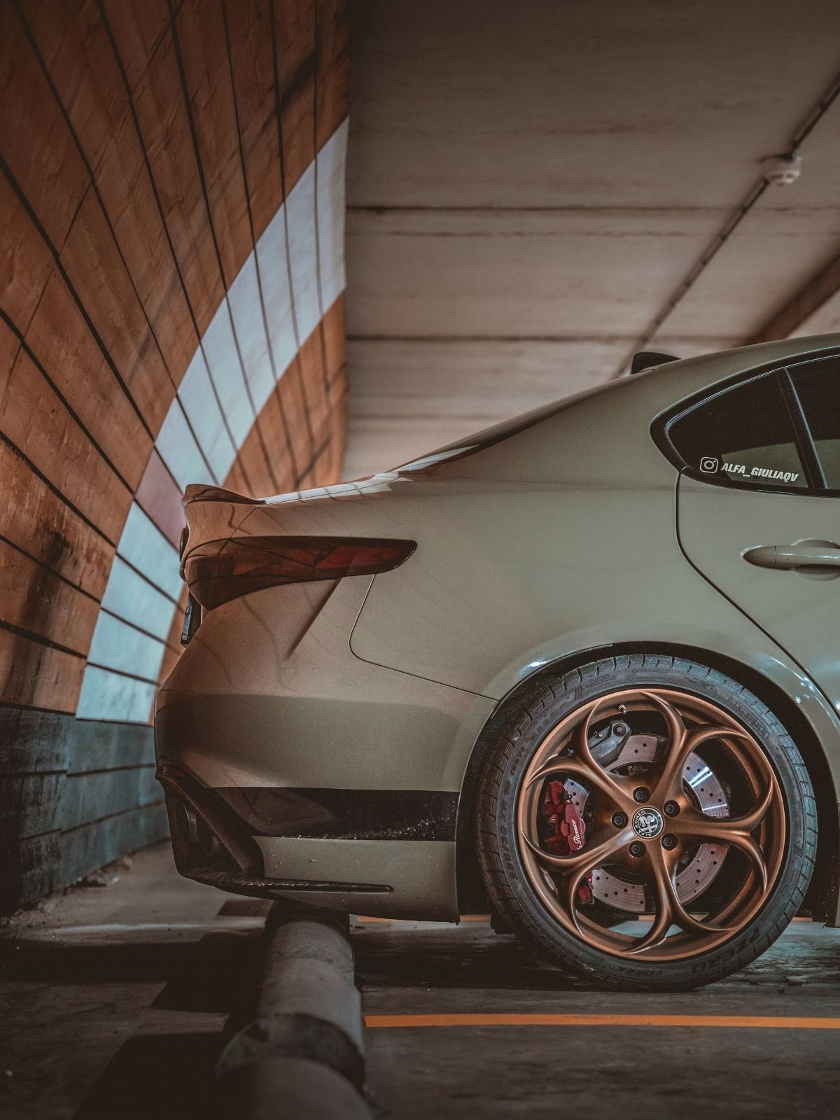 Khaki Green Alfa Romeo Giulia Quadrifolgio on gold rims