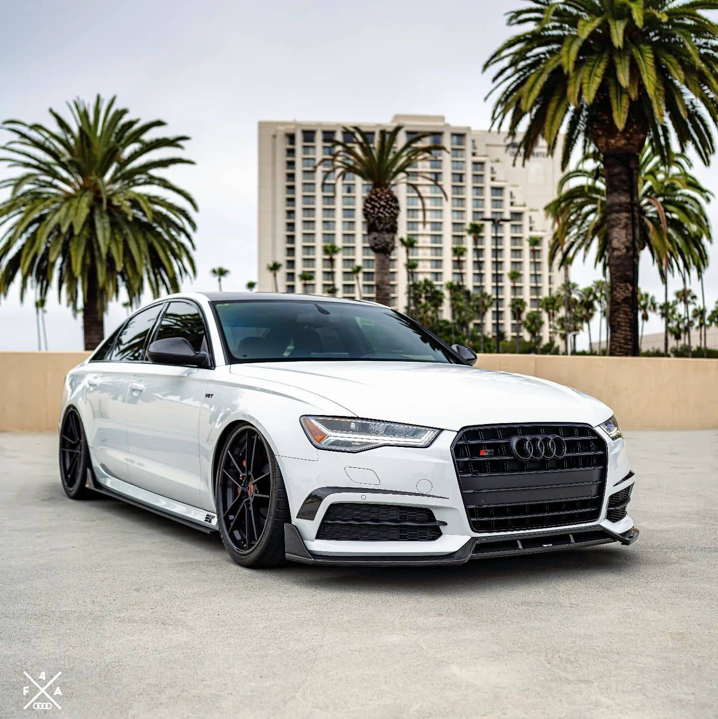 White Audi S6 with blacked out grille and Karbel Carbon Fiber front splitter