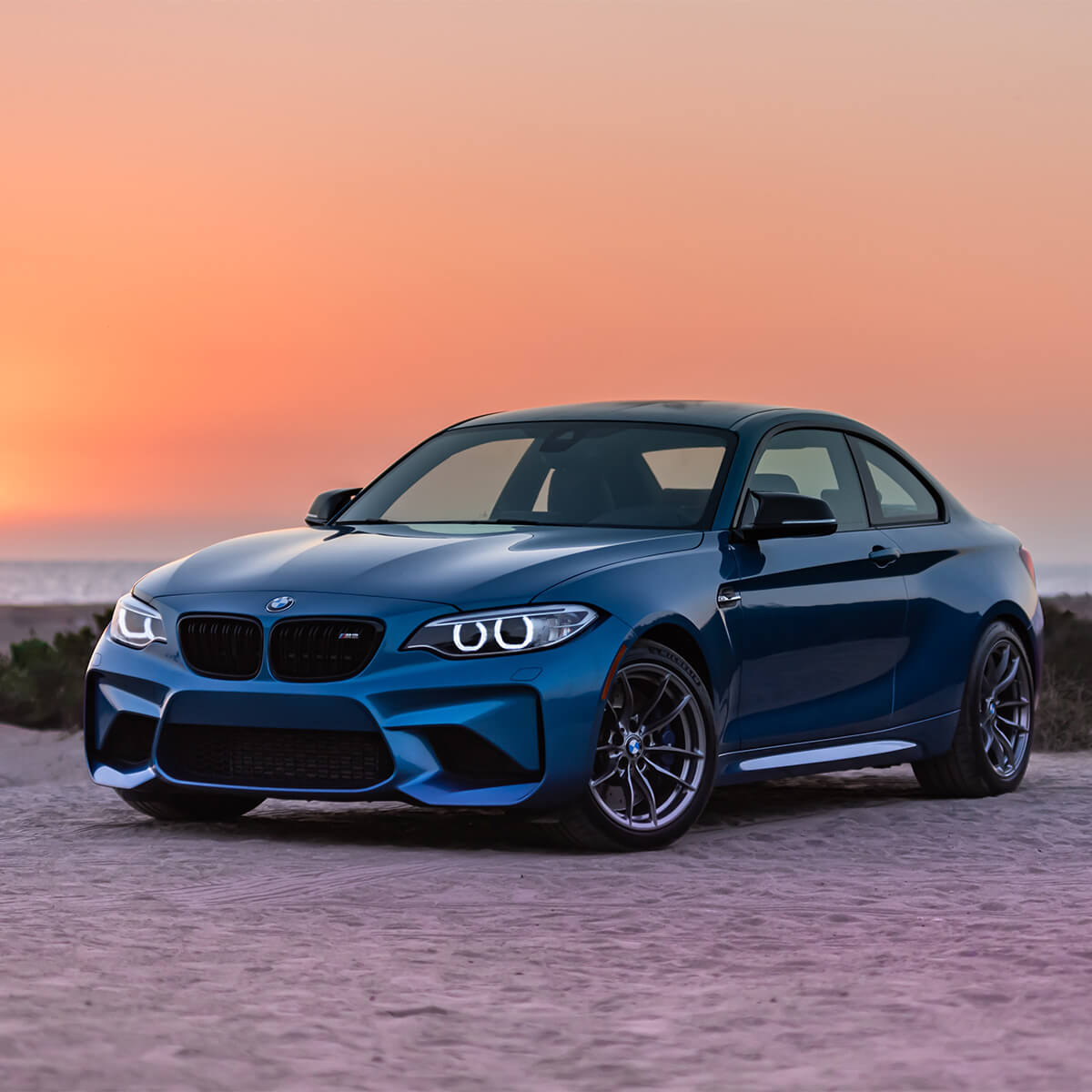 Blue BMW M2 factory bumper and halo LED headlights