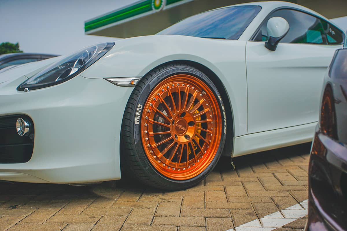 Porsche Cayman on orange Rotiform custom wheels
