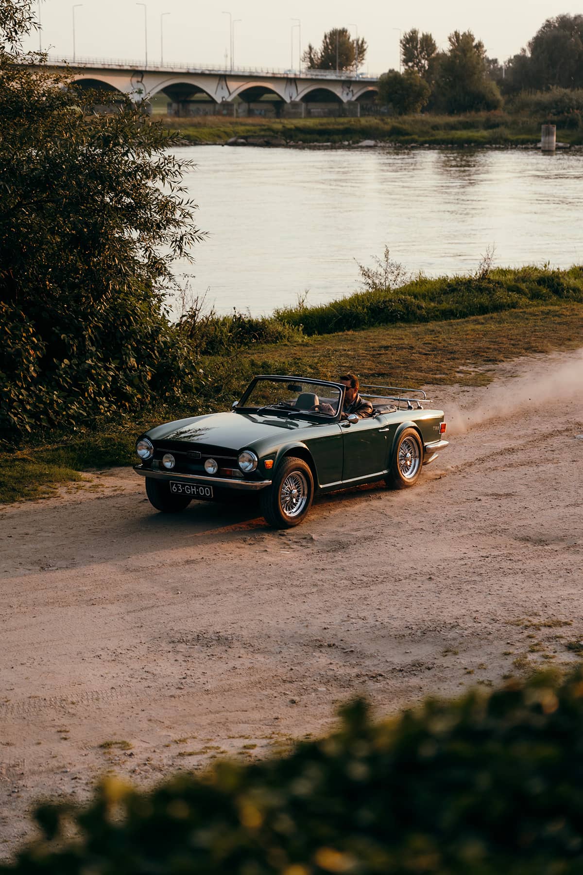 Triumph TR6 roadster in British Racing Green color.