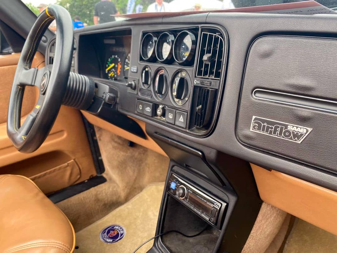 Saab 900 convertible interior with black dash and tan leather seats