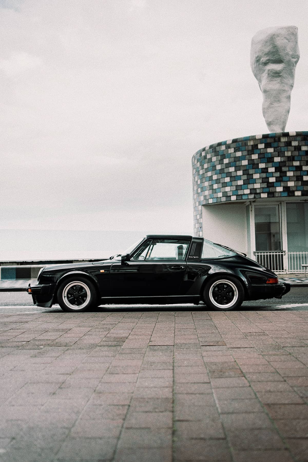 Classic Black Porsche 930 Targa with black Fuchs wheels and polished lips