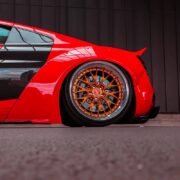 Lowered Audi R8 on Rotiform 3-piece custom wheels with orange centers and polished lips