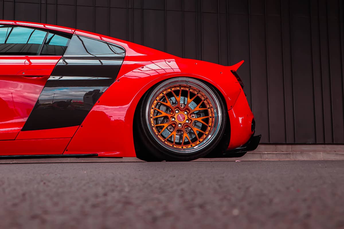 Lowered Audi R8 on Rotiform 3-piece custom wheels with orange centers and polished lips
